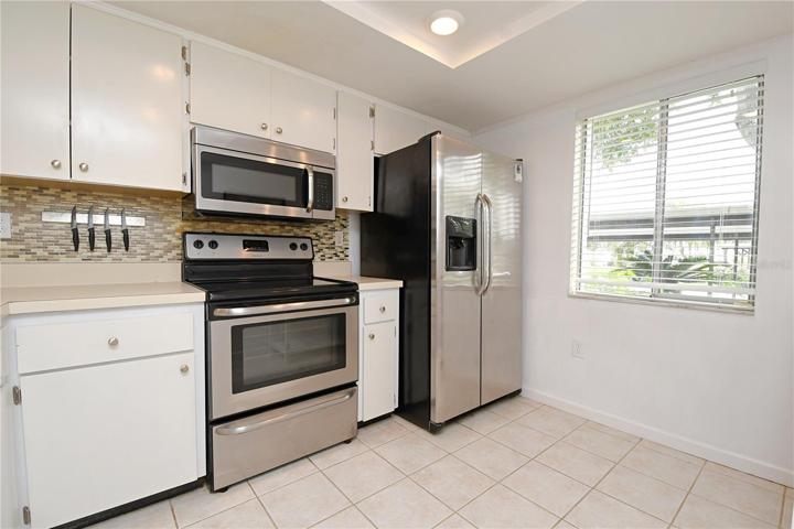 The kitchen comes with matching stainless steel appliances.