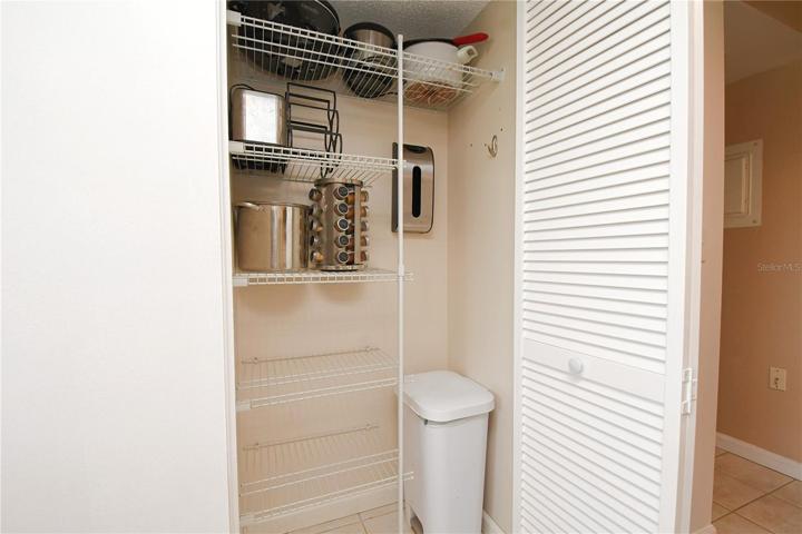 The kitchen includes spacious pantry closet with built-in shelves.