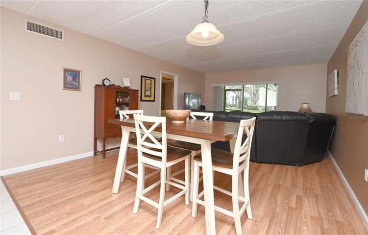 Step inside and be greeted by the spacious living room/dining room combo, perfect for entertaining guests or simply relaxing after a long day.