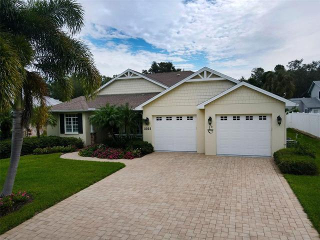 front of home with paver brick driveway
