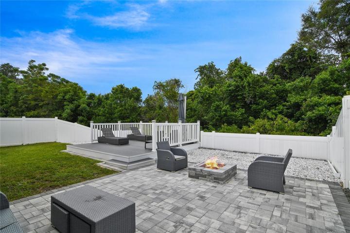 Your backyard has been custom crafted for endless hours of entertainment, from the screened lanai to the patio with a fire pit and raised deck - there is space for everyone with the perfect wooded view!
