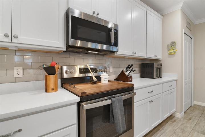 Stainless steel appliances and subway tile backsplash!