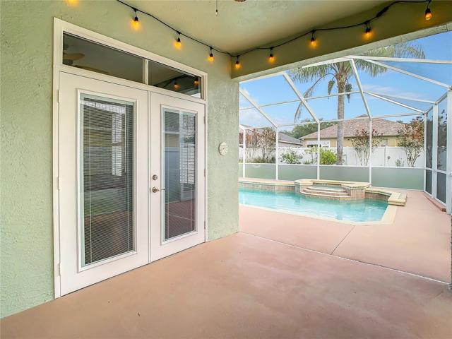 View of the Enclosed Pool and Master Bedroom French Doors
