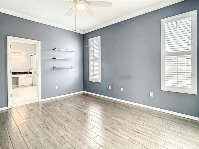 Master Bedroom With the En Suite Bathroom and Walk-In Closet to the Left