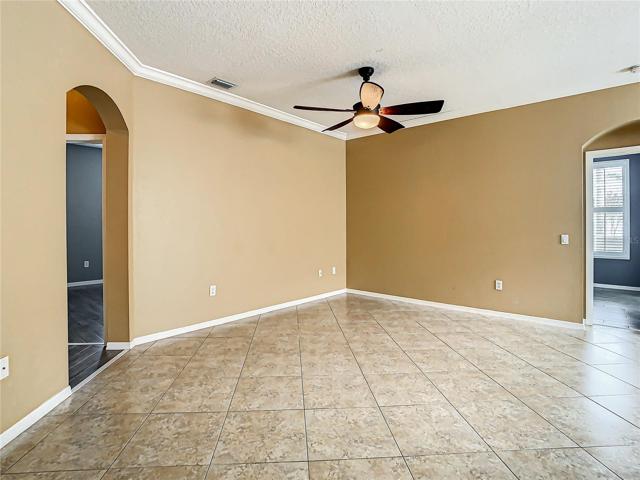 Family Room, Master En Suite Entrance to the Right, Bedrooms Two, Three, and the Hall Full Bath to the Left