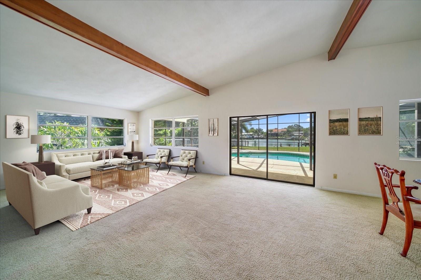 This photo has been virtually staged. Great Room at rear of property