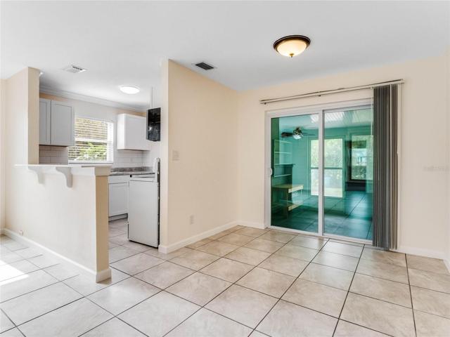 View of kitchen and dining area that leads to a private patio!