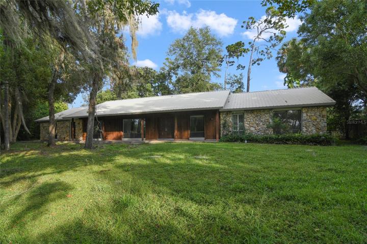 This Lake Gatlin area GEM has a BRAND NEW KITCHEN, BATHROOMS, FLOORS and PAINT; plus a SCREENED POOL and LAKE VIEWS!