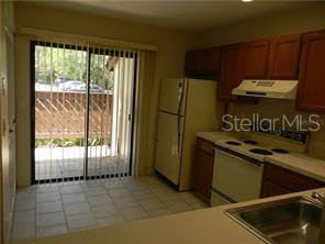 Kitchen with access to front porch & storage room