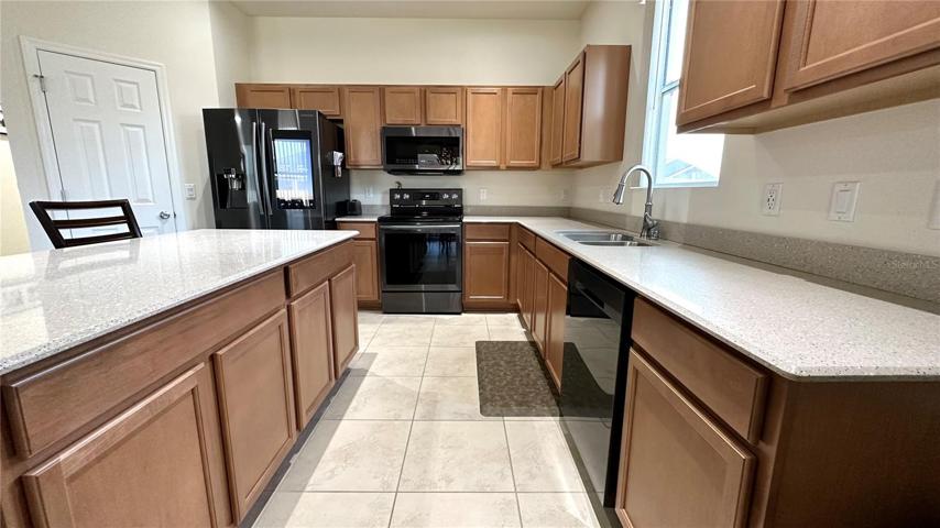 Kitchen with granite counters and stainless steel appliances