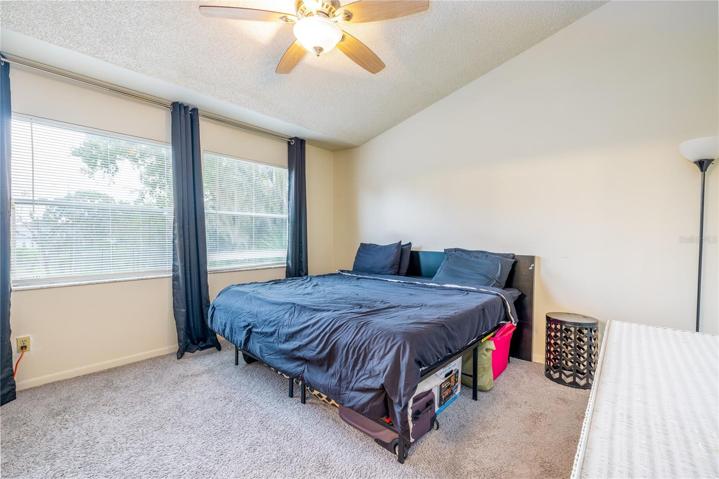 Large main bedroom with high ceilings and tons of light