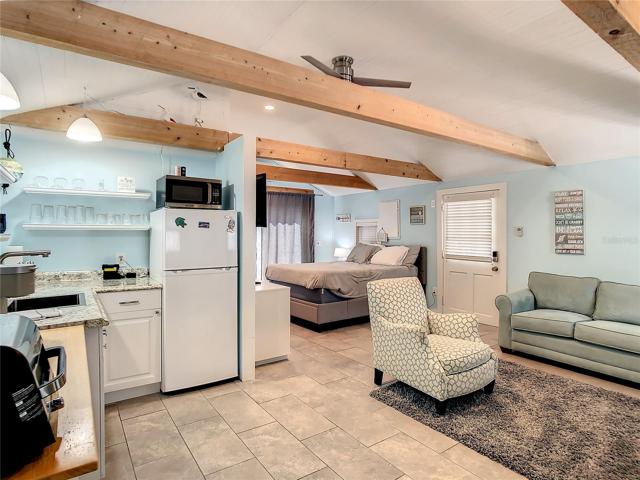 Another view, this one from the northeast corner of  the Studio cottage - being sold fully furnished. Although this space is just around 430 Sf, it feels bigger due to the high ceilings.