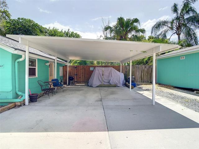 2 car carport next to the Studio cottage. To the right is RV parking and to the right of that is the 12'x22' garage. Out of view, to the left is another parking space.
