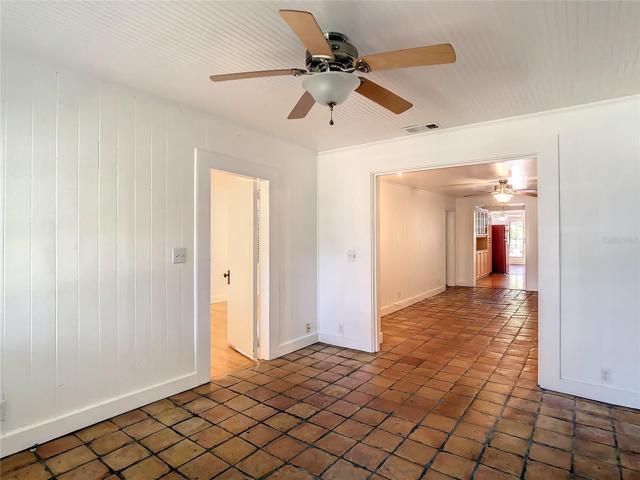 Front room view from front door towards west. Open door to the left leads to primary bedroom.