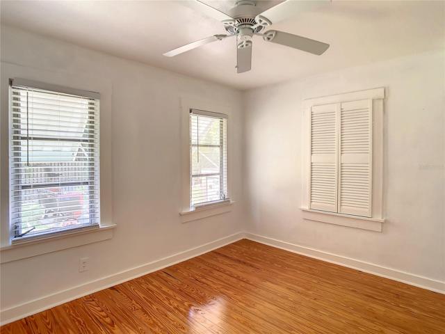 2nd bedroom. View from door. Windows face west & look out into the side yard.