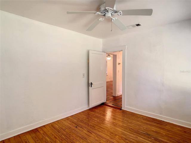 2nd bedroom. View from windows towards door.