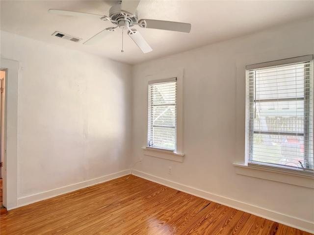 2nd bedroom. View from back corner. Windows face west & look out into the side yard.