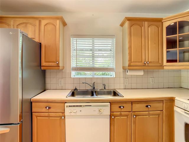 Closer view of kitchen sink area. That is a bay window, facing east.