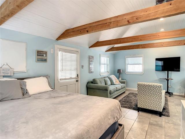Studio cottage- View from bath door towards front door. Being sold furnished. Although this space is just around 430 Sf, it feels bigger due to the high ceilings.