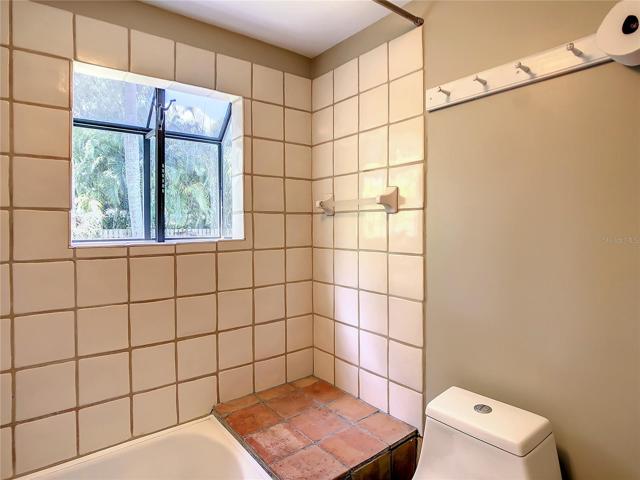Hall bath. Updated toilet, tub & vanity, with a bay window.