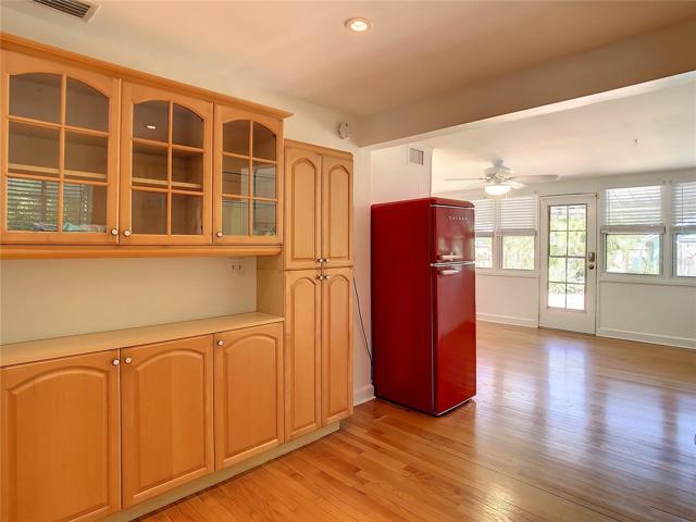 Kitchen & Florida room. Red fridge does not convey.