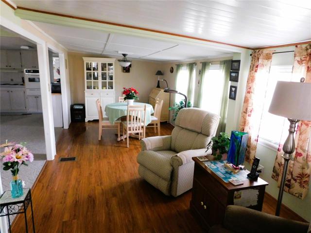 Open concept living room, dining and kitchen.
