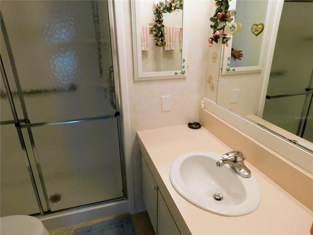 Main bathroom has step-in shower.