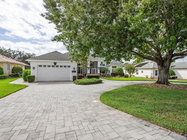 Mature landscaping and paver drive and walkway