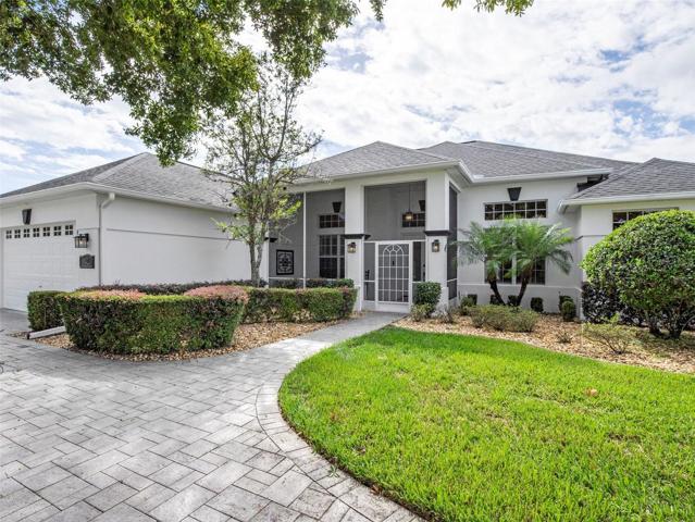 Front view of home with paver drive and walkway