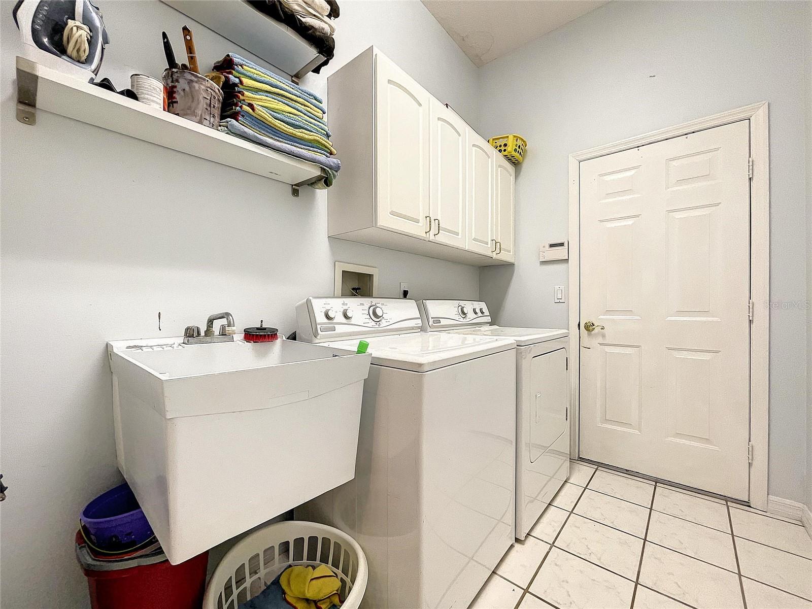Laundry room leading to garage