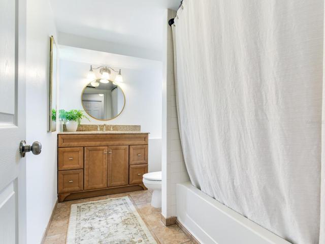 Hall Full Bath with shower and tub enclosure
