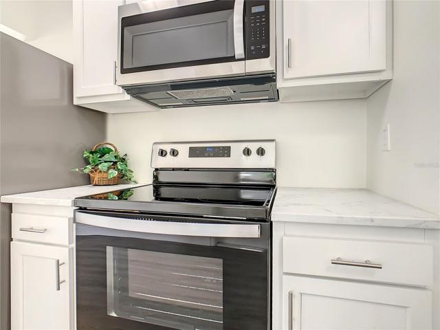 Remodeled kitchen with new stainless-steel appliances.