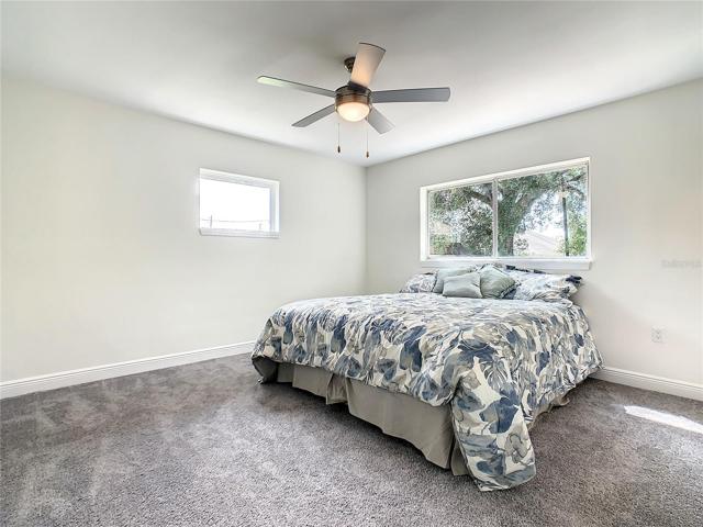 Master bedroom has a large window overlooking the back yard.