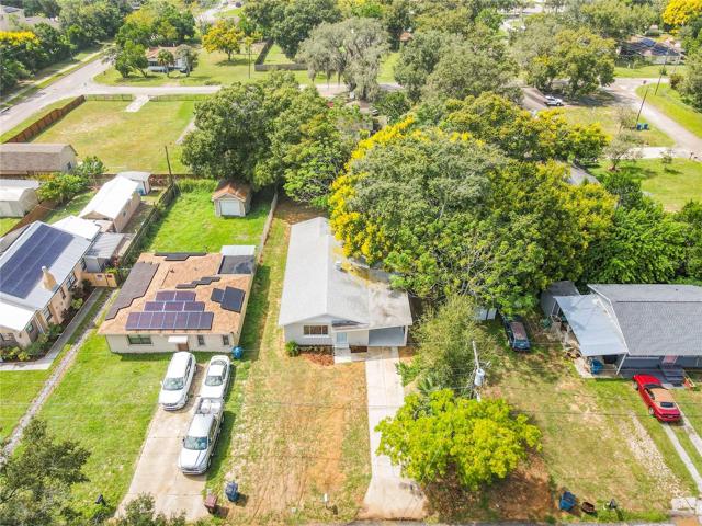 Aerial view of home on lot.
