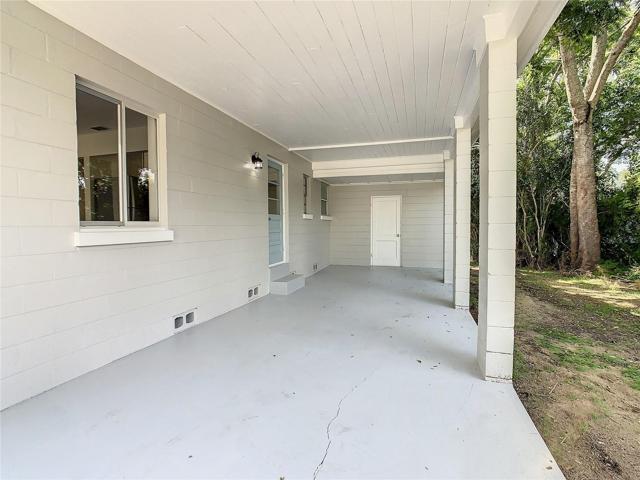 Carport with utility room at the back of it.