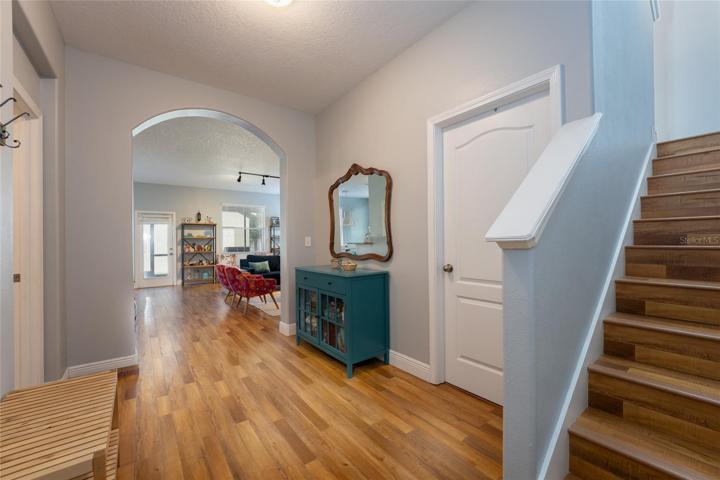 Hallway with stairs to second floor on the right.