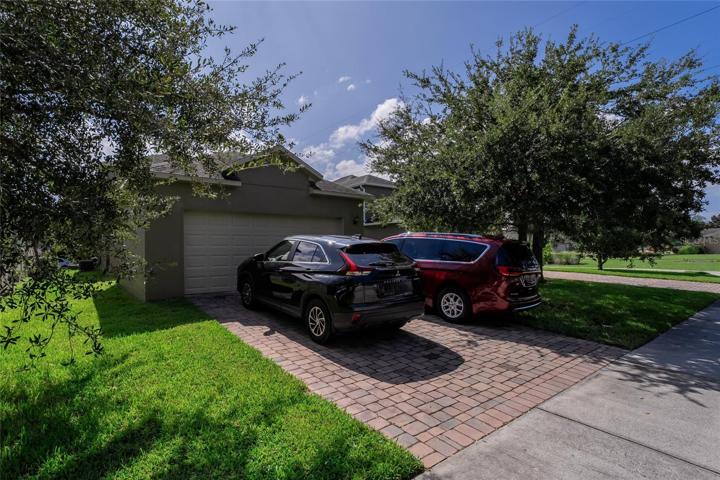 2 car Garage and driveway with extra 2 parking spaces.
