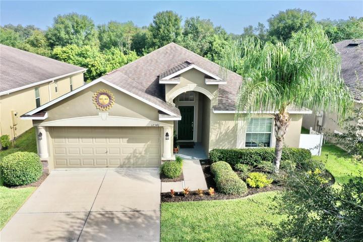 Front of home, appealing manicured landscaping