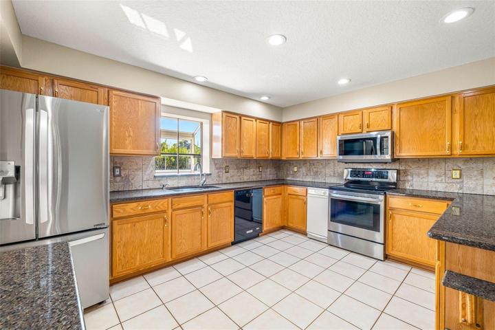 GRANITE COUNTER TOPS, NEWER APPLIANCES, TRASH COMPACTOR!