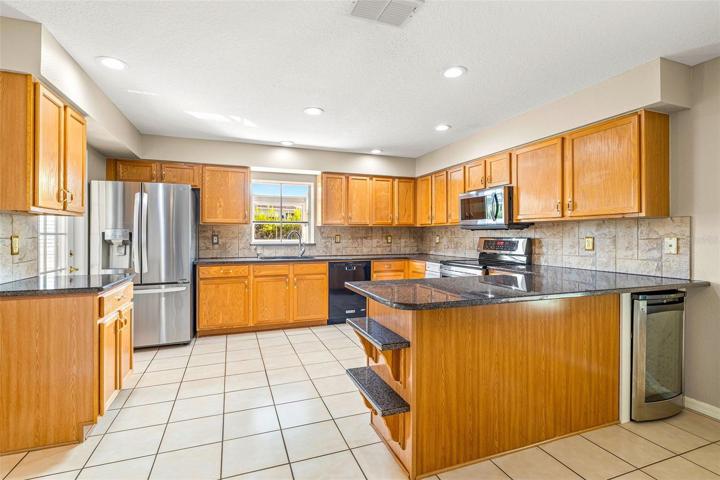PLENTY OF WOOD CABINETS AND PREP COUNTER SPACE!