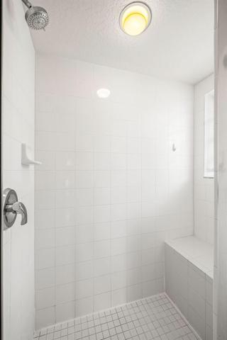 TILED SHOWER WITH BENCH AND WINDOW!