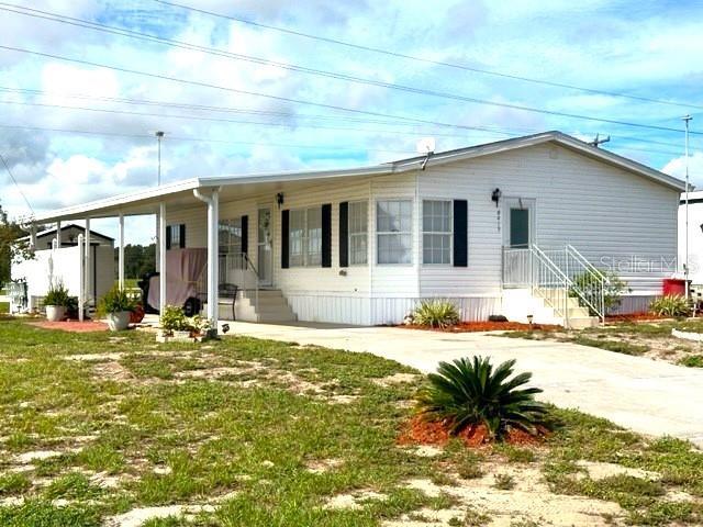 EXTERIOR FRONT WITH CARPORT