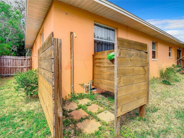 The Large Fully fenced-in back yard offers plenty of green space and a storage shed. Keep the dirt outside or wash dogs with the unique shower set up in the back yard too.