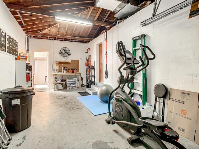 The garage entry door is also in the family room. Follow through the garage to the large utility room which also has a half bathroom and is plumbed for a shower.