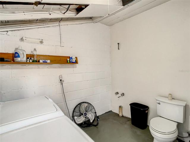 The garage entry door is also in the family room. Follow through the garage to the large utility room which also has a half bathroom and is plumbed for a shower.