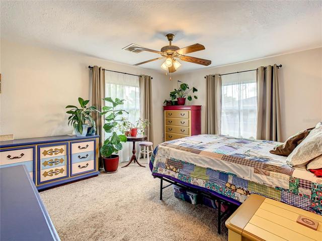 Bedroom one with lots of windows