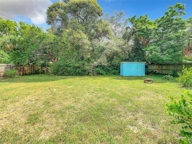 The Large Fully fenced-in back yard offers plenty of green space and a storage shed. Keep the dirt outside or wash dogs with the unique shower set up in the back yard too.