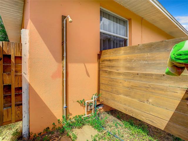 The Large Fully fenced-in back yard offers plenty of green space and a storage shed. Keep the dirt outside or wash dogs with the unique shower set up in the back yard too.