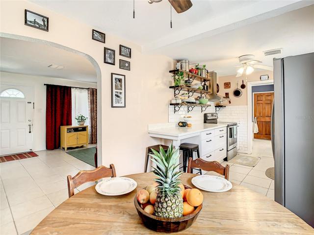 eat-in breakfast nook furnished with a long built-in bench that maximizes space and seating while providing storage space underneath.