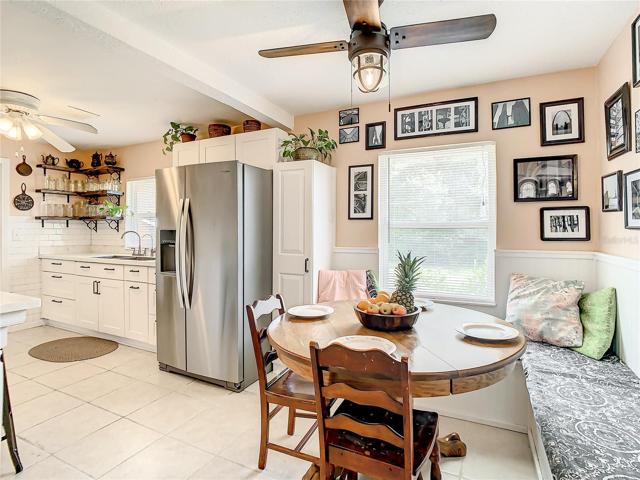 eat-in breakfast nook furnished with a long built-in bench that maximizes space and seating while providing storage space underneath.